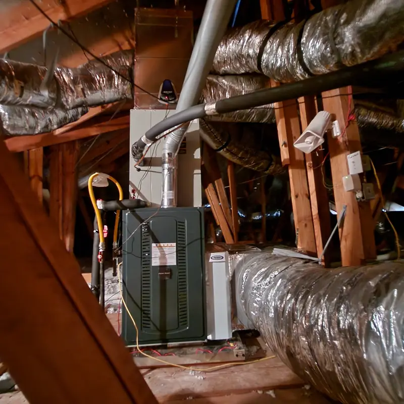 Air handler and ductwork in an attic with an Aprilaire accessory fitted
