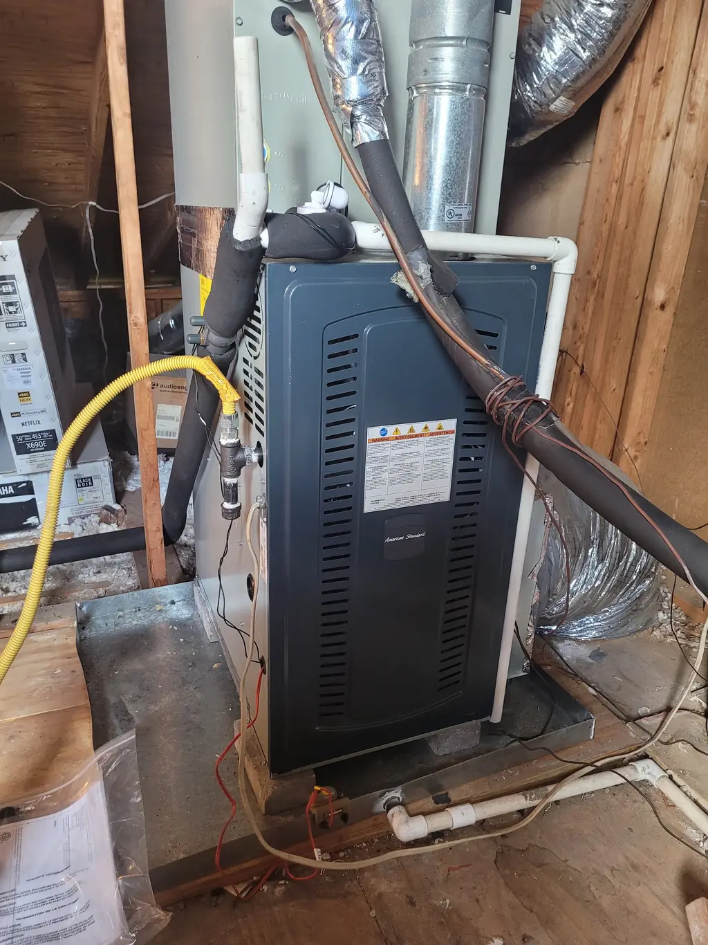 American Standard furnace and air handler installed in an attic